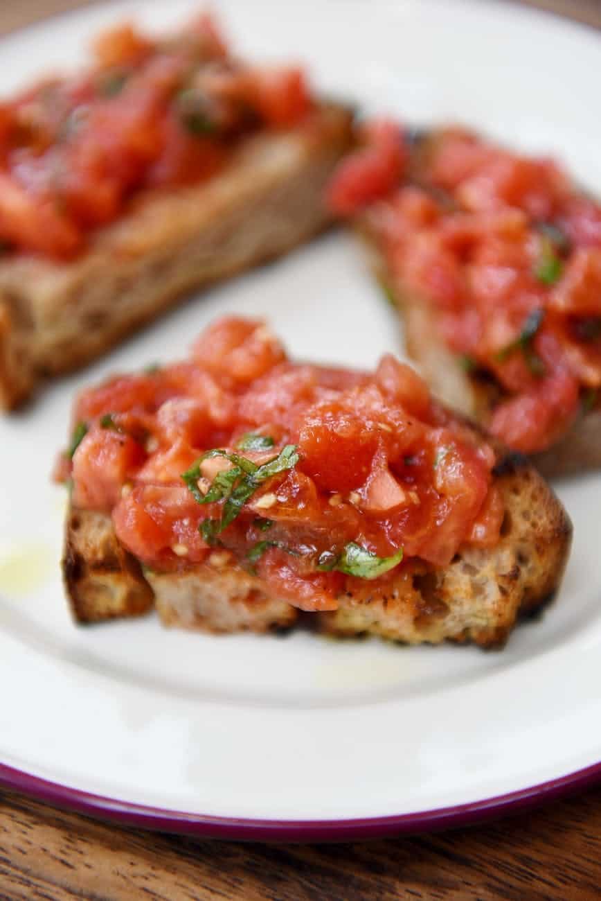 a bruschetta on a ceramic plate